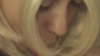 Blonde whore filmed when deep sucking a dog cock
